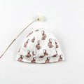 Petit bonnet en coton biologique imprimé de lapins beige