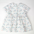Robe bébé en tissu Liberty thème fruits des bois, fabriquée en France.