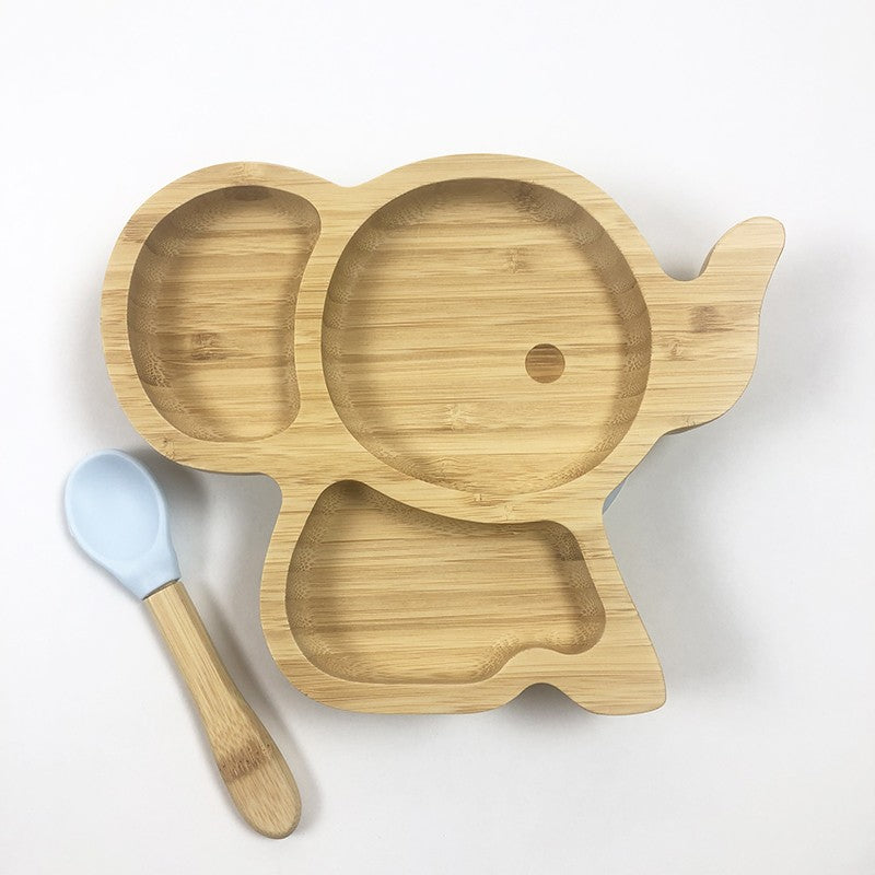 Bambou naturel pour cette assiette en forme d'éléphanteau à compartiments et la petite cuillère assortie
